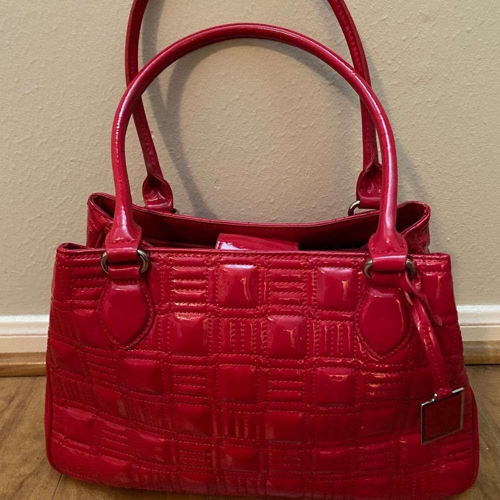 Red patent satchel. Used maybe 3 times. Excellent condition. 15 x 9 x 5.5 approx